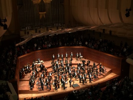 Photo of conductor bowing at the conclusion of a San Francisco Symphony performance